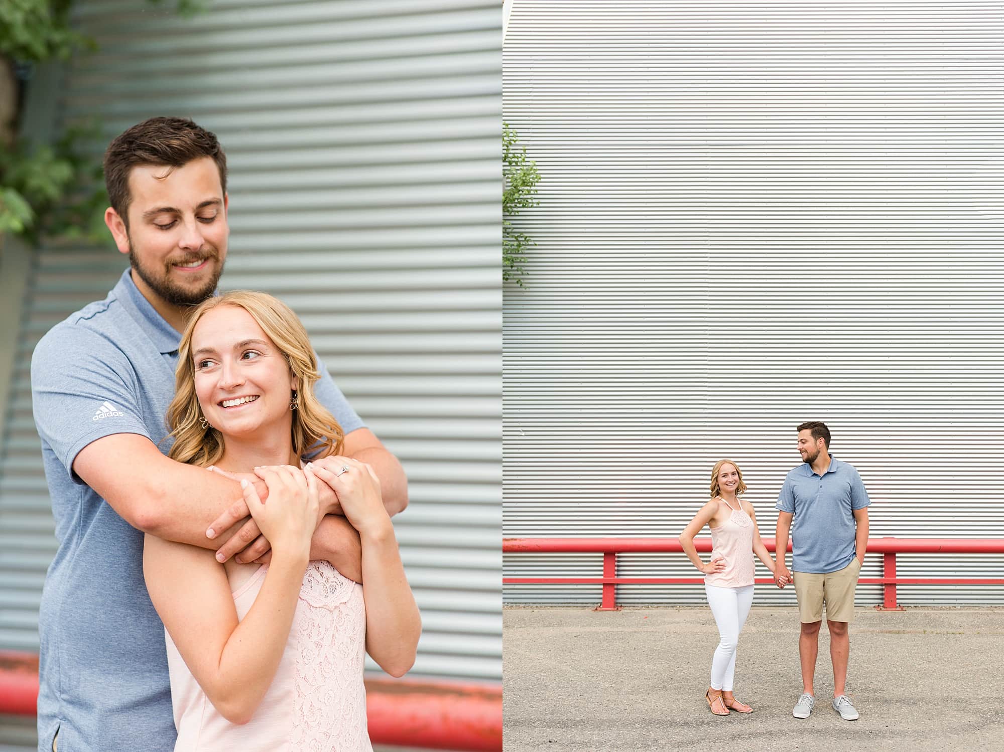 An engaged couple stand in front of a metal wall with a red railing in Downtown Fargo