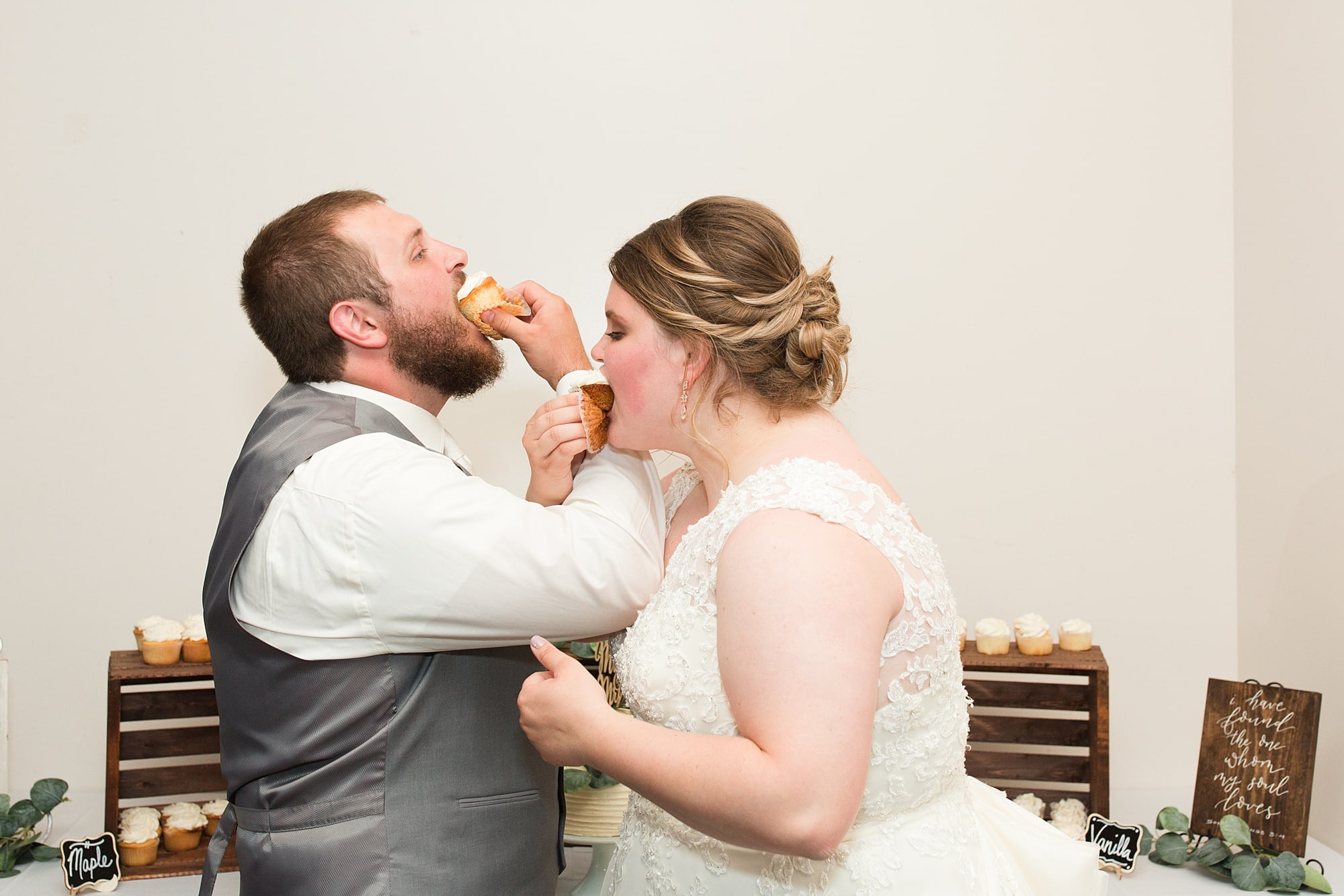 Newly wed couple eats cupcakes at their Wedding Reception Bemidji Eagles