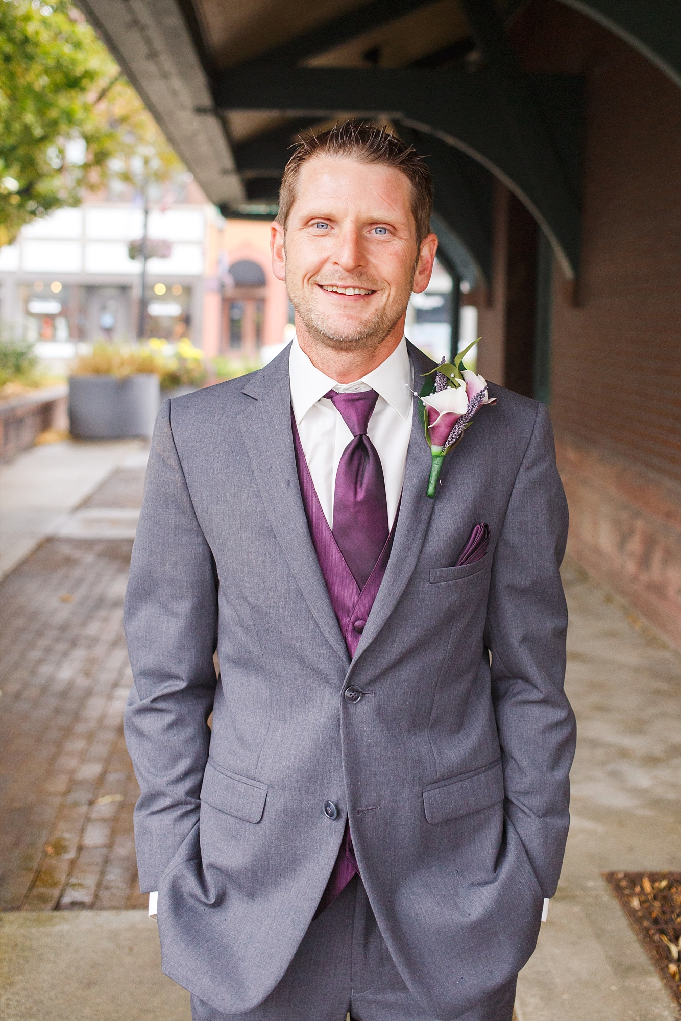 Groom in purple and grey 