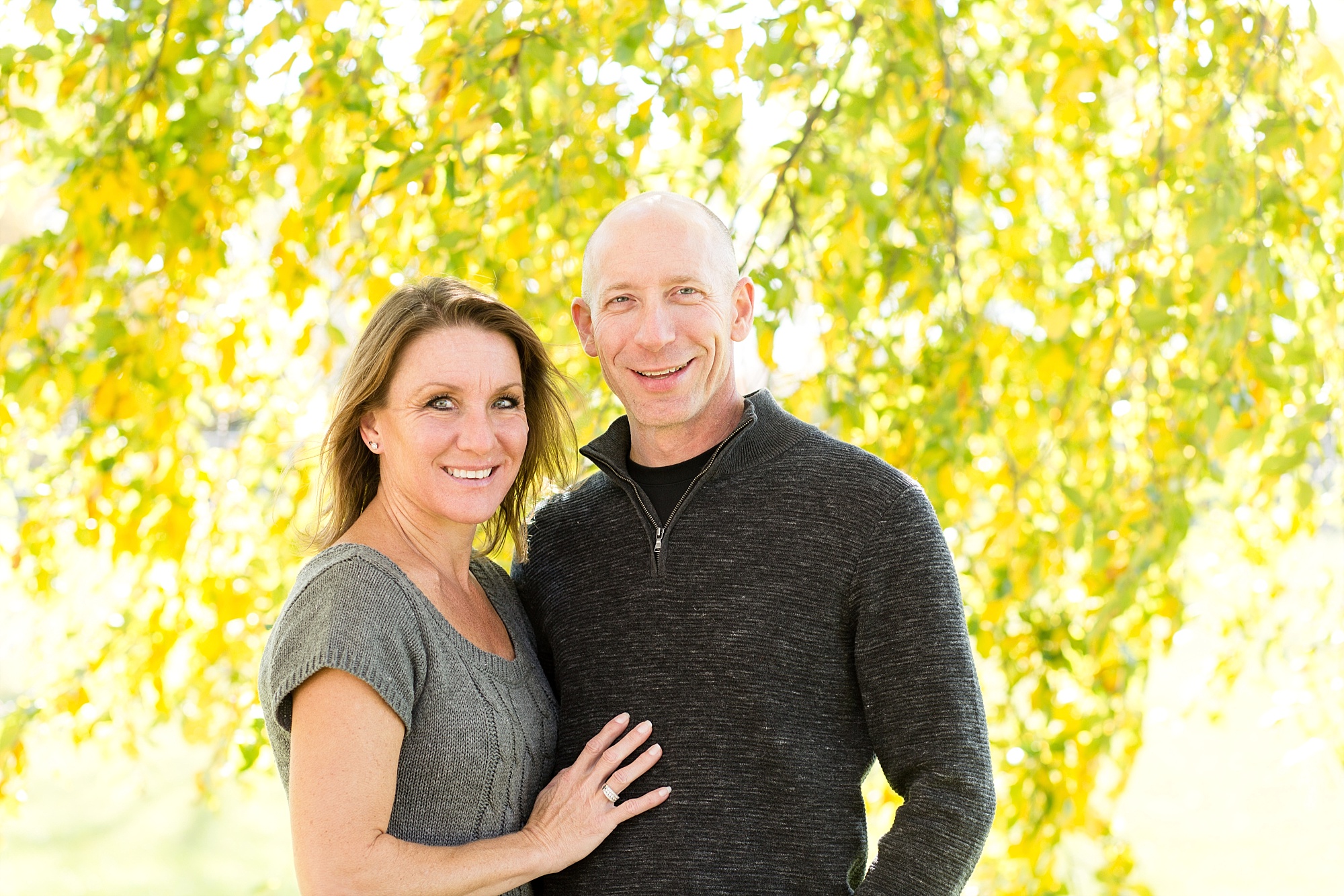 Couple in front of Yellow Leaves