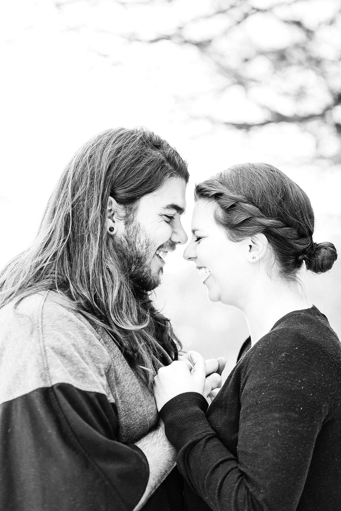 Laughing couple in black and white engagement photo