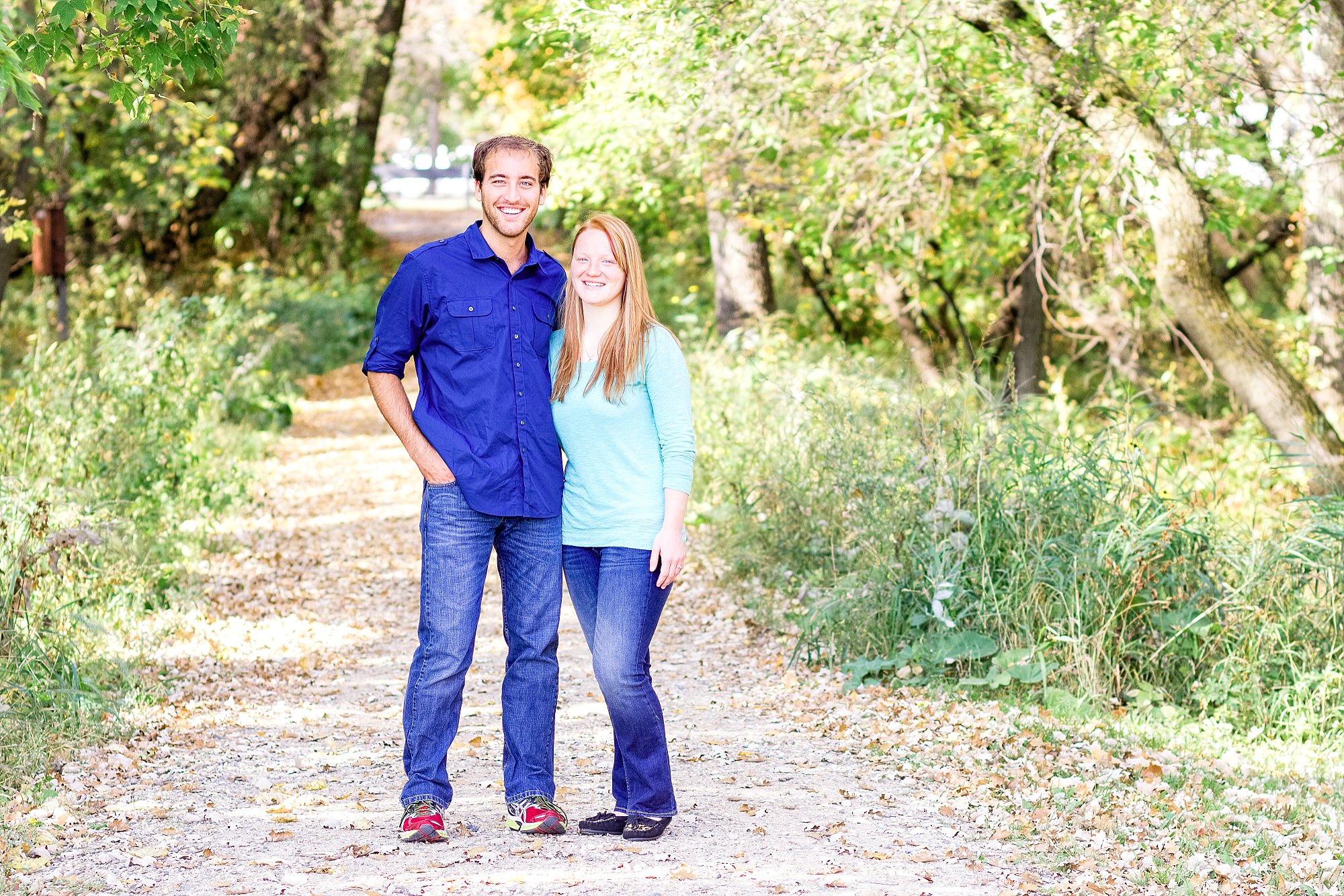 Engaged couple on gravel path in Buffalo River State Park Engagement Session
