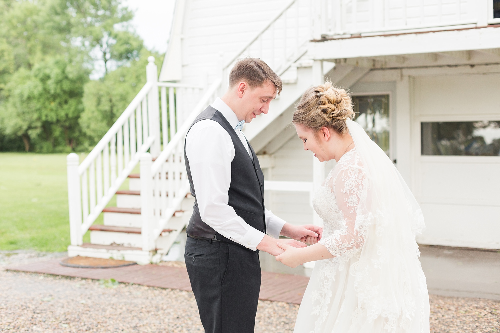A bride and groom see each other for the first time during their Fargo wedding