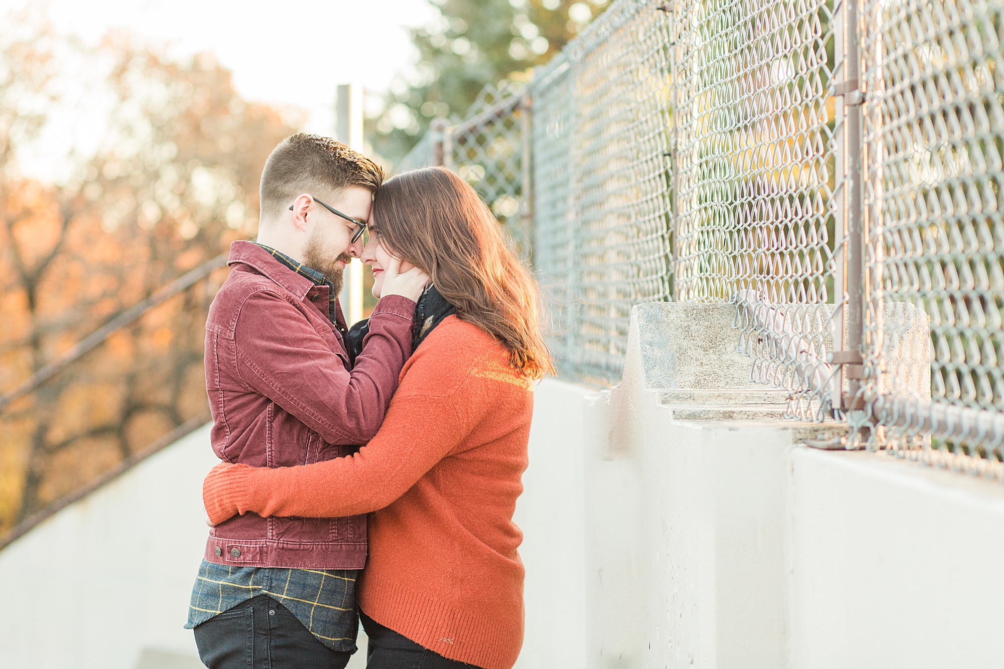 Sunset glows on an engaged couple in Island Park