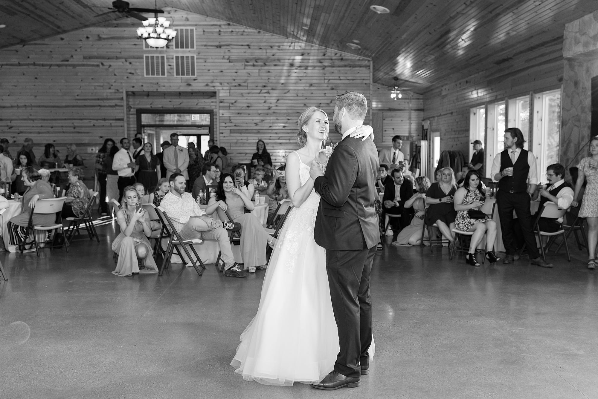 Bride and groom share their first dance during their  Romantic Moons Event Center wedding reception