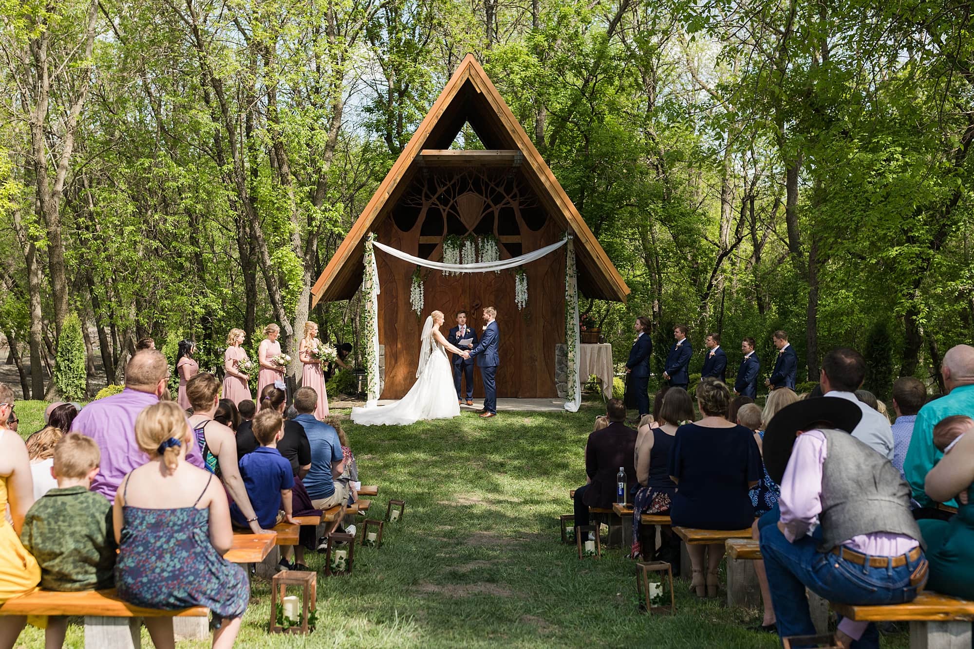 Outdoor summer wedding ceremony at  Romantic Moons Event Center