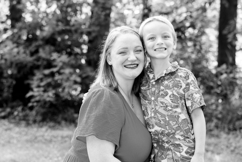 Mother and son smile during their family photos in Lindenwood Park